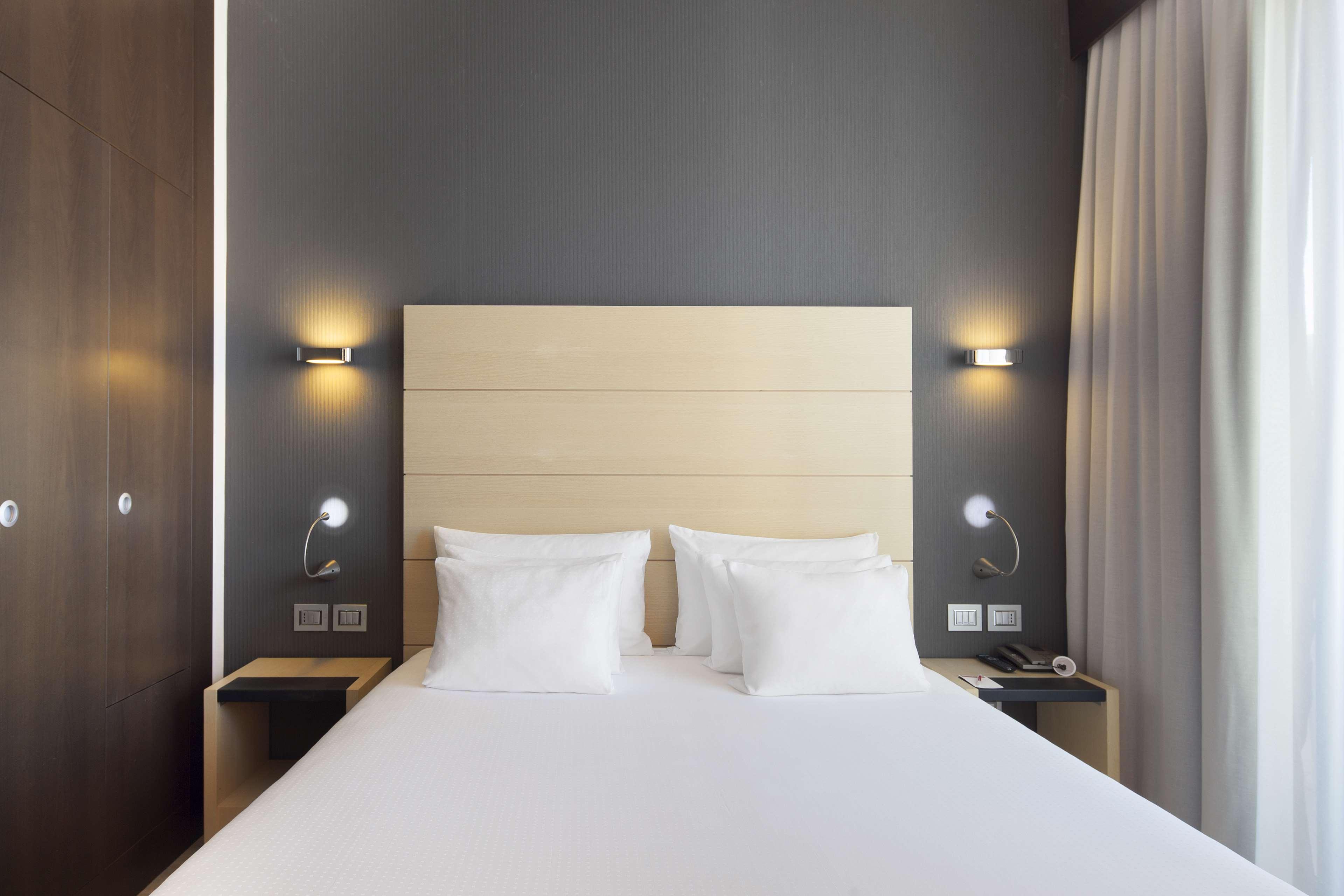 Nh Collection Milano President Hotel Bagian luar foto A room at the hotel